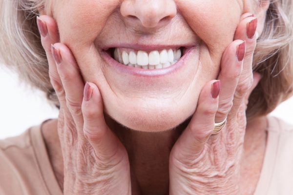 Smiling old woman with dentures